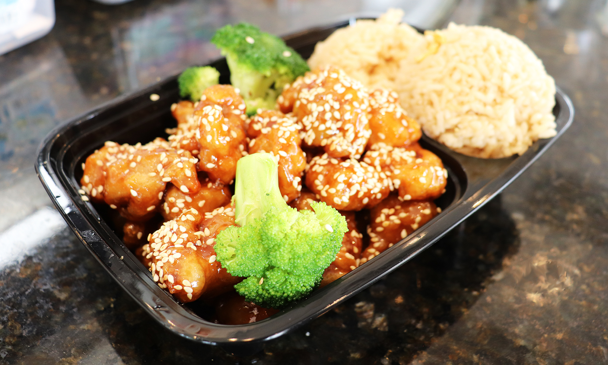 Wok Xpress orange chicken, fried rice, and lo mein